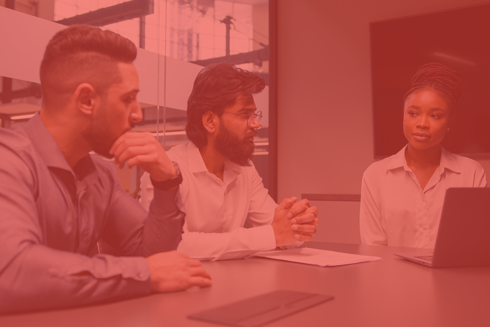 Group of people working out business plan in an office